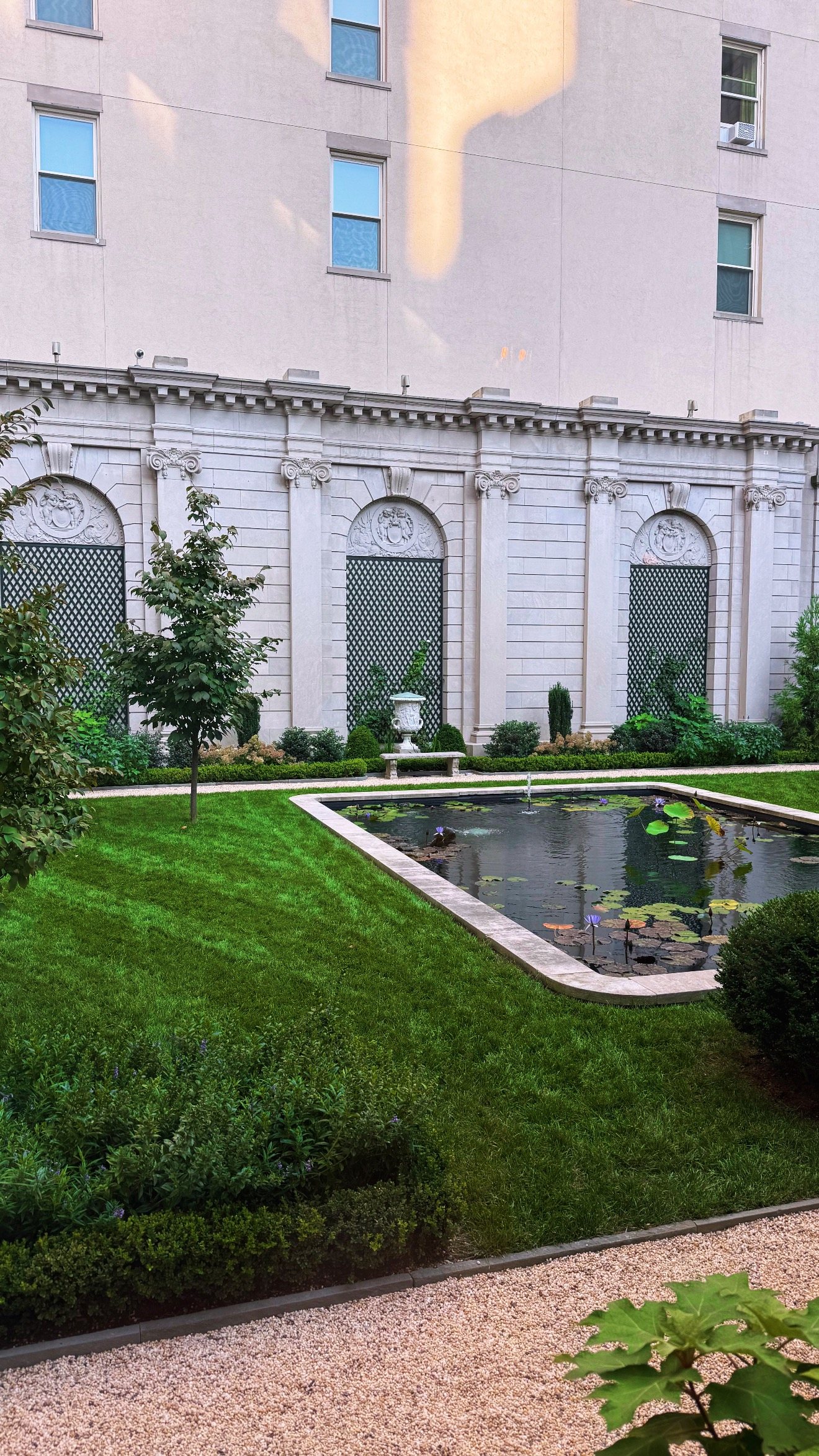 A quiet garden courtyard with a lily pond in Manhattan